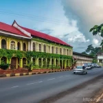 카메룬 보야 지역의 역사적 명소 - **Prompt 1: Colonial Echoes in Buea's Streets**
    "A wide-angle, medium shot capturing the histori...
